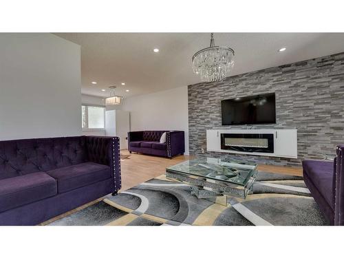 4855 Rundlewood Drive Ne, Calgary, AB - Indoor Photo Showing Living Room With Fireplace
