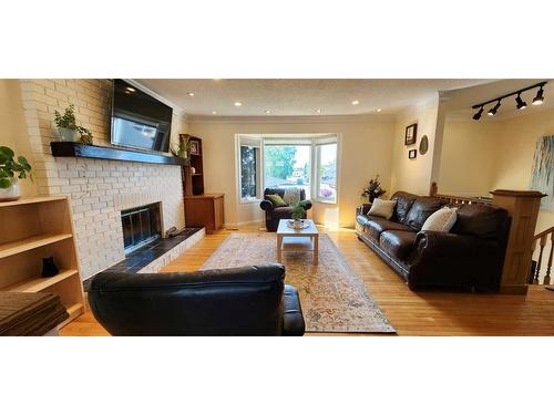 195 Becker Crescent, Fort Mcmurray, AB - Indoor Photo Showing Living Room With Fireplace