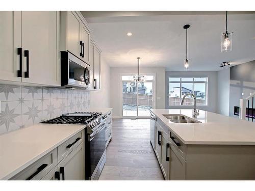 44 Precedence View, Cochrane, AB - Indoor Photo Showing Kitchen With Double Sink With Upgraded Kitchen