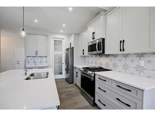 44 Precedence View, Cochrane, AB - Indoor Photo Showing Kitchen With Double Sink With Upgraded Kitchen