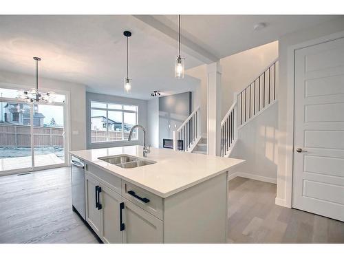 44 Precedence View, Cochrane, AB - Indoor Photo Showing Kitchen With Double Sink