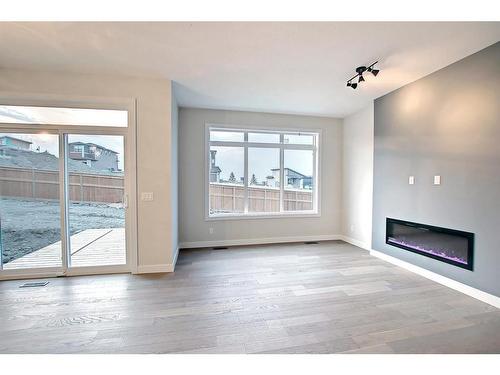 44 Precedence View, Cochrane, AB - Indoor With Fireplace