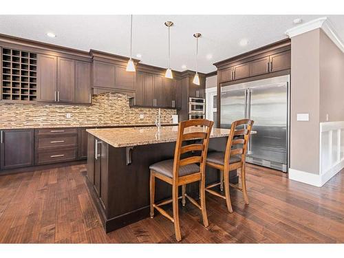 820 Coopers Square Sw, Airdrie, AB - Indoor Photo Showing Kitchen With Upgraded Kitchen