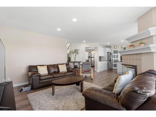 10063 Hidden Valley Drive Nw, Calgary, AB - Indoor Photo Showing Living Room With Fireplace