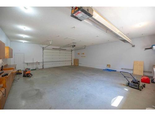 112 Baird Avenue, Cochrane, AB - Indoor Photo Showing Garage