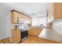 112 Baird Avenue, Cochrane, AB  - Indoor Photo Showing Kitchen With Double Sink 