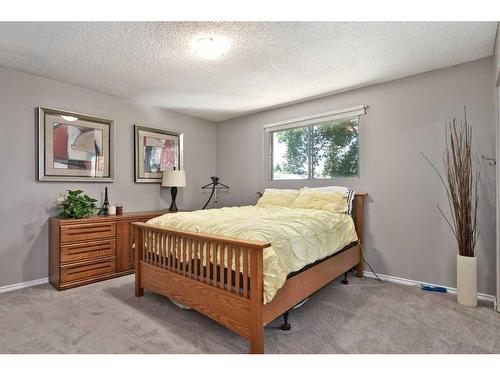 163 Wood Crest Place Sw, Calgary, AB - Indoor Photo Showing Bedroom