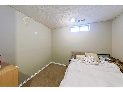 163 Wood Crest Place Sw, Calgary, AB - Indoor Photo Showing Bedroom