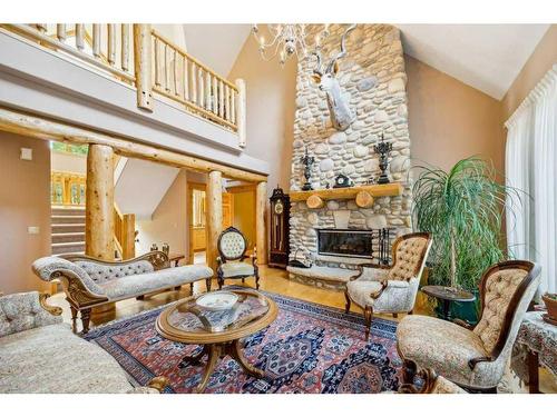 3 Woodlands Estates Crescent, Rural Rocky View County, AB - Indoor Photo Showing Living Room With Fireplace