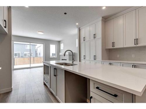 569 Rivercrest View, Cochrane, AB - Indoor Photo Showing Kitchen With Double Sink