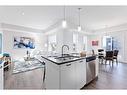 425-115 Sagewood Drive, Airdrie, AB  - Indoor Photo Showing Kitchen With Double Sink With Upgraded Kitchen 