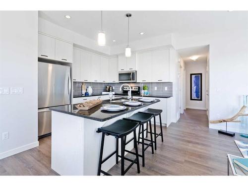 425-115 Sagewood Drive, Airdrie, AB - Indoor Photo Showing Kitchen With Stainless Steel Kitchen