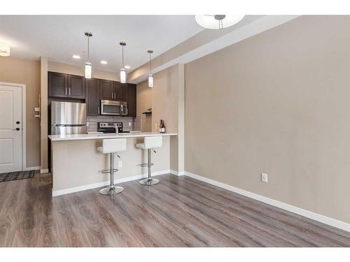 318-10 Mahogany Mews Se, Calgary, AB - Indoor Photo Showing Kitchen With Upgraded Kitchen