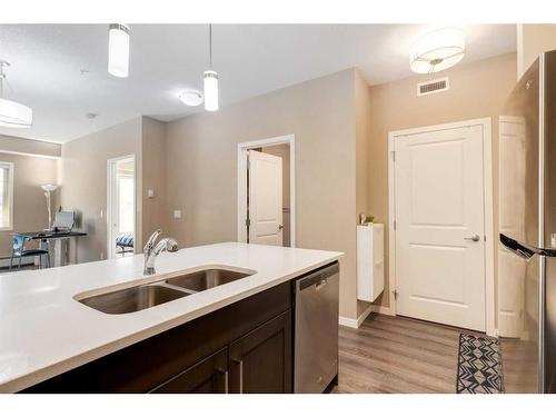 318-10 Mahogany Mews Se, Calgary, AB - Indoor Photo Showing Kitchen With Double Sink