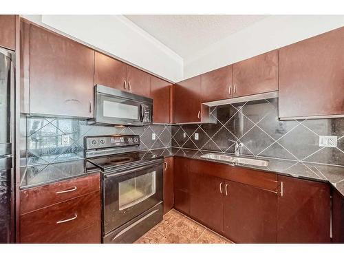 1701-8880 Horton Road Sw, Calgary, AB - Indoor Photo Showing Kitchen