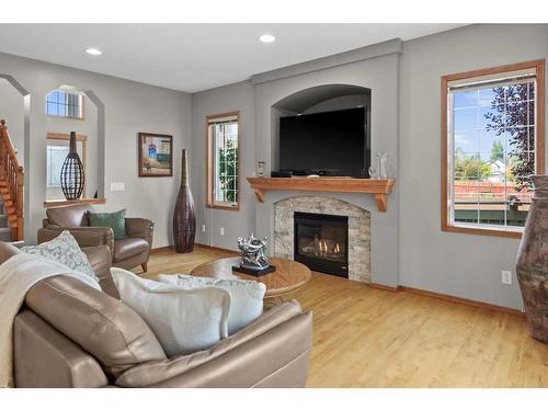 135 Chapman Circle Se, Calgary, AB - Indoor Photo Showing Living Room With Fireplace