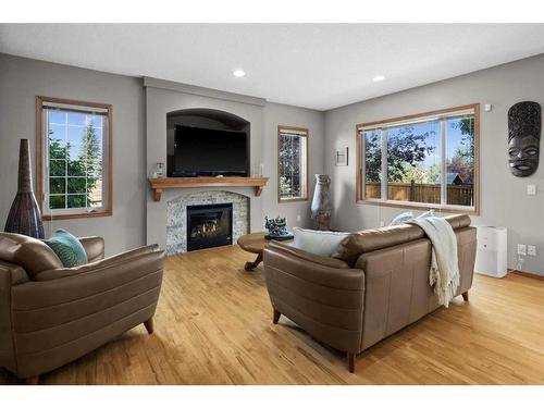 135 Chapman Circle Se, Calgary, AB - Indoor Photo Showing Living Room With Fireplace