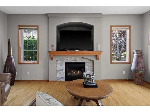 135 Chapman Circle Se, Calgary, AB - Indoor Photo Showing Living Room With Fireplace