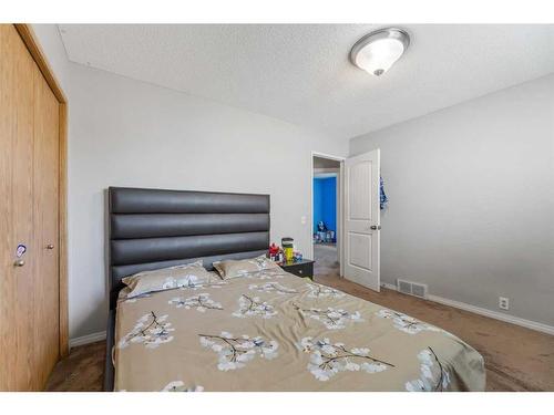 32 Martinwood Way Ne, Calgary, AB - Indoor Photo Showing Bedroom