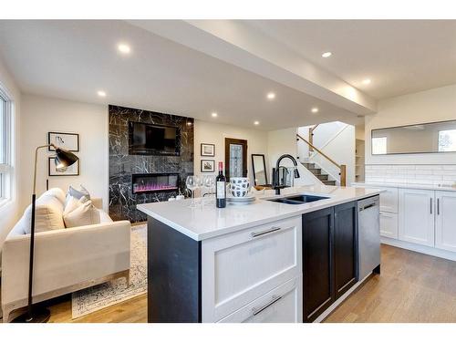 2126 18A Street Sw, Calgary, AB - Indoor Photo Showing Kitchen With Fireplace With Double Sink
