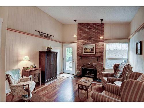 116 Lake Lucerne Close Se, Calgary, AB - Indoor Photo Showing Living Room With Fireplace
