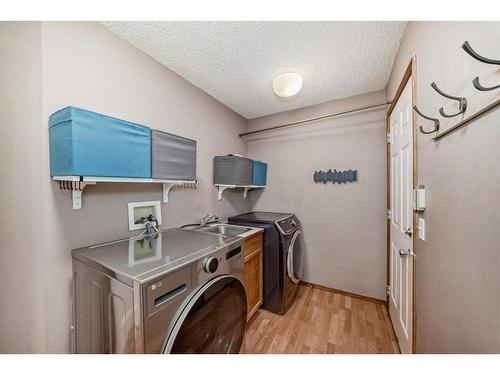 8 Arbour Glen Close Nw, Calgary, AB - Indoor Photo Showing Laundry Room