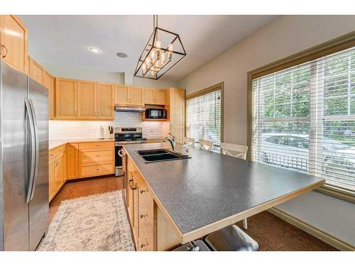 33 Somme Boulevard Sw, Calgary, AB - Indoor Photo Showing Kitchen With Stainless Steel Kitchen With Double Sink