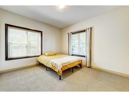 33 Somme Boulevard Sw, Calgary, AB - Indoor Photo Showing Bedroom