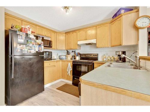 166 Harvest Rose Circle Ne, Calgary, AB - Indoor Photo Showing Kitchen With Double Sink