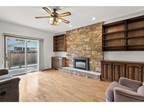 303 Valencia Place Nw, Calgary, AB - Indoor Photo Showing Living Room With Fireplace