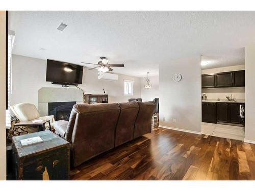 11035 24 Street Sw, Calgary, AB - Indoor Photo Showing Living Room With Fireplace