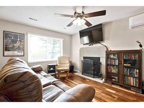 11035 24 Street Sw, Calgary, AB - Indoor Photo Showing Living Room With Fireplace