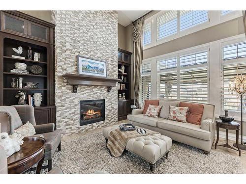 113 Silverado Crest Landing Sw, Calgary, AB - Indoor Photo Showing Living Room With Fireplace