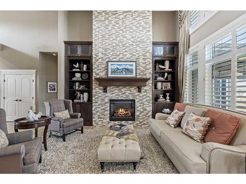 113 Silverado Crest Landing Sw, Calgary, AB - Indoor Photo Showing Living Room With Fireplace