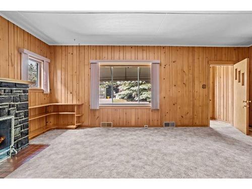 404 Otter Street, Banff, AB - Indoor Photo Showing Other Room With Fireplace