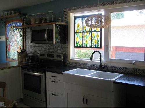 3948 43 Avenue, Red Deer, AB - Indoor Photo Showing Kitchen With Double Sink