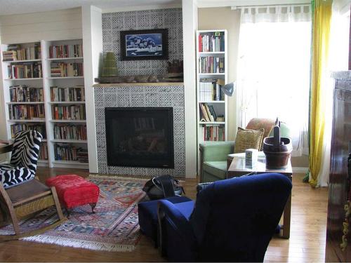 3948 43 Avenue, Red Deer, AB - Indoor Photo Showing Living Room With Fireplace