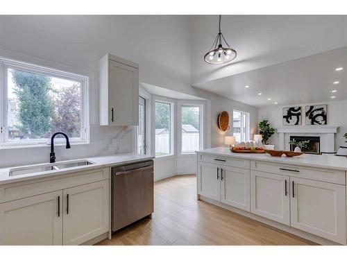 16 Hawktree Close Nw, Calgary, AB - Indoor Photo Showing Kitchen With Double Sink
