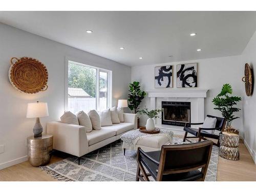 16 Hawktree Close Nw, Calgary, AB - Indoor Photo Showing Living Room With Fireplace
