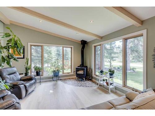 1 Manyhorses Park, Rural Rocky View County, AB - Indoor Photo Showing Living Room With Fireplace