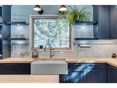 1 Manyhorses Park, Rural Rocky View County, AB - Indoor Photo Showing Kitchen With Double Sink