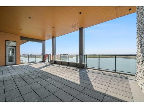 301-180 Marina Cove Se, Calgary, AB - Outdoor With Body Of Water With View With Exterior