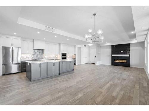 202-180 Marina Cove Se, Calgary, AB - Indoor Photo Showing Kitchen With Stainless Steel Kitchen With Upgraded Kitchen