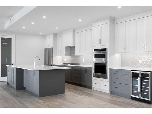 202-180 Marina Cove Se, Calgary, AB - Indoor Photo Showing Kitchen With Stainless Steel Kitchen With Upgraded Kitchen