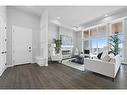 302-180 Marina Cove Se, Calgary, AB  - Indoor Photo Showing Living Room With Fireplace 