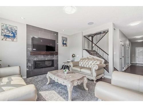 110 Red Sky Green Ne, Calgary, AB - Indoor Photo Showing Living Room With Fireplace