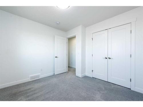 1020 Iron Landing Way, Crossfield, AB - Indoor Photo Showing Other Room