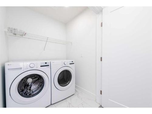 1020 Iron Landing Way, Crossfield, AB - Indoor Photo Showing Laundry Room