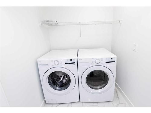 1020 Iron Landing Way, Crossfield, AB - Indoor Photo Showing Laundry Room