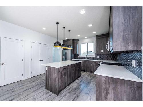 1020 Iron Landing Way, Crossfield, AB - Indoor Photo Showing Kitchen With Upgraded Kitchen